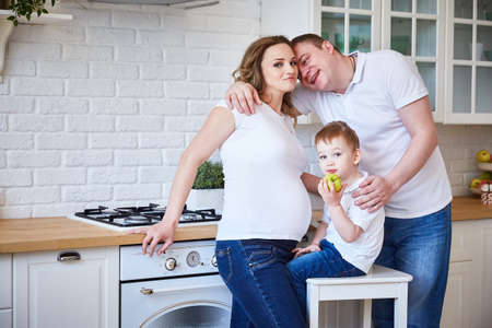 Happy young family in the kitchen. lifestyleの写真素材