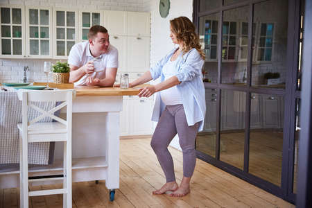 young couple in love in the kitchenの写真素材