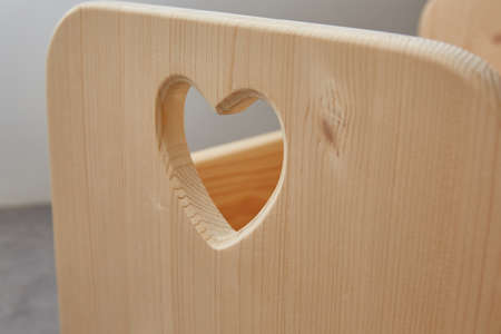 wooden piece with a carved heart. close upの写真素材