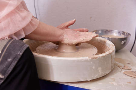 Work on the potters wheel. bowl making.の写真素材