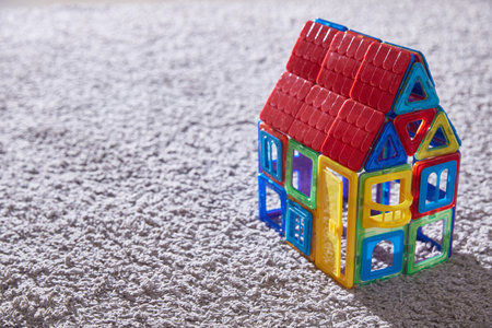House toy constructor on the carpet. Copy spaceの写真素材