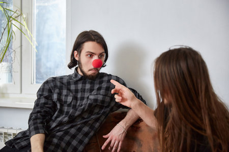 two guys fool around like clowns at home.の写真素材