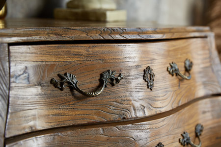 Vintage curved chest of drawers close-up. Forged handlesの写真素材