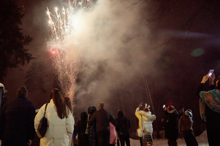 People watch fireworks in winter. Lifestyleの写真素材