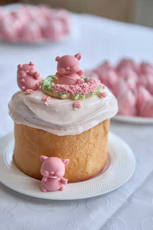 Charming whimsy radiates from this exquisitely detailed Easter cake, piled high with playful pink...