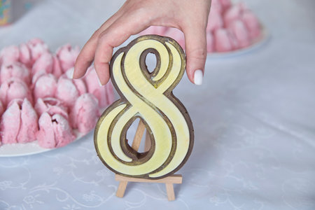 Celebrating International Woman's Day, a heartfelt gesture, this golden eight symbolizes feminine...