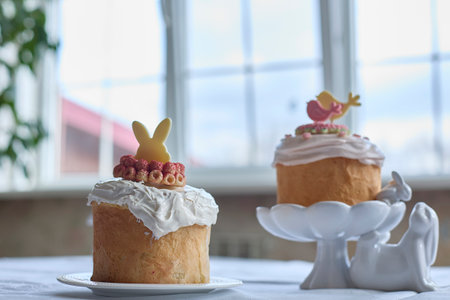 Gentle springtime nostalgia radiates from a freshly baked Ukrainian Easter cake, adorned with...