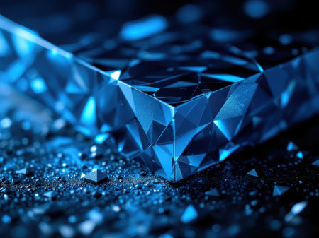 Macro of a faceted blue crystal on a dark textured background.の素材