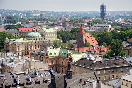 Aerial view of the roofs of houses in the historic part of Krakow with church of the Holy Cross and other buildings. Poland.の写真素材