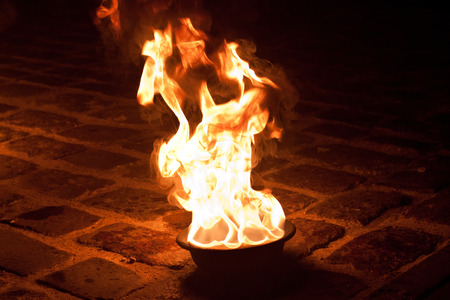 Orange flames on the old pavement.の写真素材