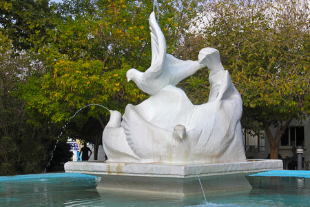 CYPRUS, KYRENIA - NOVEMBER 11, 2013: Fountain and sculpture in the form of pigeons in the city park of Kyrenia (Girne) in Northern Cyprus. Kyrenia is a cultural and economical centre of Northern Cyprus.のeditorial素材