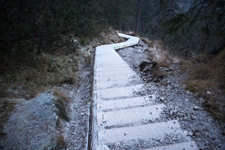 Wooden staircase covered with frost in the High Tatras mountains.