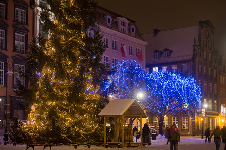 POLAND, GDANSK - DECEMBER 30, 2014: Christmas tree in the festive decorations on Long Market (Dlugi Targ) street. Gdansk is a Polish city on the Baltic coast and popular center of tourism.のeditorial素材