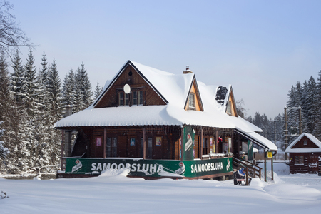 SLOVAKIA, LYSA POLANA - JANUARY 05, 2015: Product shop in traditional wood cottage near polish-slovak border on the road from Zakopane (Poland) to Tatranska Lomnica (Slovakia) in High Tatras mountainsのeditorial素材