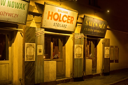 POLAND, KRAKOW - JANUARY 01, 2015: Szeroka Street at night in Kazimierz with prewar views, is now the well-known restaurant Polakowski. Kazimierz is the former jewish quarter of Krakow.のeditorial素材