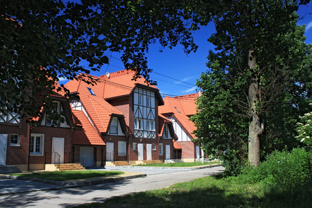 MORSKOE, KALININGRAD REGION, RUSSIA - JUNE 19, 2011: New cottages in the style of half-timbered houses in the Morskoe (Pillkoppen) village in the Curonian Spit National Park. Russia.のeditorial素材