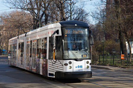 KRAKOW, POLAND - MARCH 28, 2017: Tram Bombardier NGT6 in the historic part of Krakow. Total in Krakow more than 90 kilometers of tram tracks and 24 routes.のeditorial素材