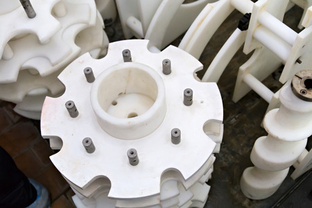Industrial dairy production. Part of automatic conveyor with bottles for milk.