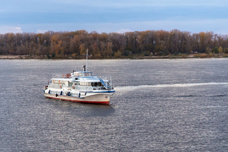 SAMARA, RUSSIA - OCTOBER 12, 2016: The trip motor ship "OM-338" on the Volga river in autumn evening. The ship was built in 1958 at the Moscow shipyard. Home port - Samara.のeditorial素材