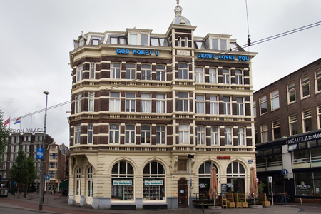 AMSTERDAM, NETHERLANDS - JUNE 25, 2017: Historical building on the Prins Hendrikkade street near the Amsterdam Centraal station. The street is in the center of city and has many historic buildings.のeditorial素材