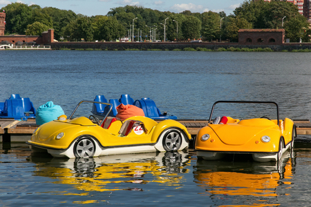 KALININGRAD, RUSSIA - AUGUST 24, 2017: Parking of water bicycles on the Upper Lake in the center of Kaliningrad. Water bicycles are a popular tourist attraction.のeditorial素材