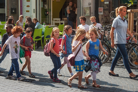 LEUVEN, BELGIUM - SEPTEMBER 05, 2014: Unknown group of the kindergarten children on a walking around the city center in Leuven. The city is the capital of Flemish Brabant province.のeditorial素材