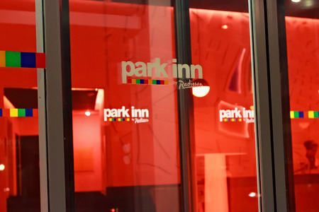 LEUVEN, BELGIUM - SEPTEMBER 05, 2014: Details of the night view of the entrance to the hotel Park Inn by Radisson in Leuven. The hotels chain held to international corporation Carlson Companies.のeditorial素材