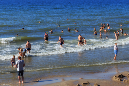 ZELENOGRADSK, KALININGRAD REGION, RUSSIA - JULY 29, 2017: Unknown people bathing in the Baltic Sea water in famous resort Zelenogradsk (formerly known as Cranz) at summer time.のeditorial素材