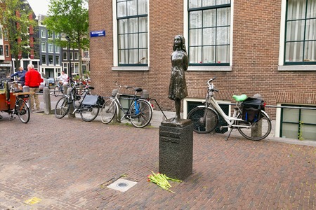 AMSTERDAM, NETHERLANDS - JUNE 25, 2017: Anne Frank statue on Westerkerk Plaza near the Anne Frank House. Anne Frank was a German-born diarist. One of the most discussed Jewish victims of the Holocaustのeditorial素材