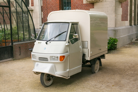 AMSTERDAM, NETHERLANDS - JUNE 25, 2017: View of a moto car Piaggio Ape 50. The Piaggio Ape is a three-wheeled light commercial vehicle based on a vespa scooter produced since 1948 by Piaggio.のeditorial素材