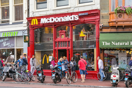 AMSTERDAM, NETHERLANDS - JUNE 25, 2017: View of the McDonald's restaurant on the Muntplein street in historical part of Amsterdam.のeditorial素材