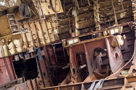 Internal parts of decommissioned marine ship that was cut and left on the shore.の写真素材