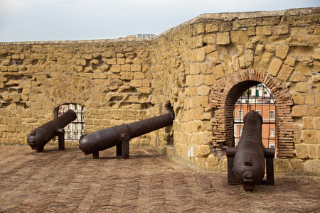 Defensive Fortifications and old guns of the medieval castle Castel dell'Ovo. The castle is the oldest standing fortification in Naples. Italy.のeditorial素材