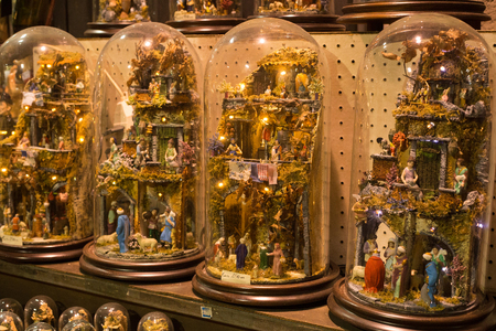 NAPLES, ITALY - OCTOBER 31, 2015: Decorative souvenir products on the market in center of Naples at night.のeditorial素材