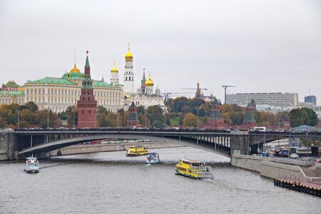 Beautiful view of the historical center of Moscow with Kremlin, Grand Palace, The Water Pump (Vodovzvodnaya) Tower and Bolshoy Kamenny Bridge and Moscow River embankment. Russia.のeditorial素材