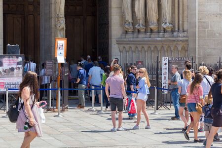 PARIS, FRANCE - JUNE 23, 2017: Queue to the Notre-Dame-de-Paris church on the place Jean Paul II...