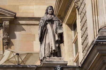 PARIS, FRANCE - JUNE 23, 2017: Charles-Louis Montesquieu (1689-1755) statue on the Louvre. He was a French judge, man of letters, and political philosopher (famous theory of separation of powers).