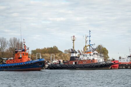BALTIYSK, KALININGRAD OBLAST, RUSSIA  - NOVEMBER 04, 2018: Russian port off-shore diesel tugboats Gladiator and Tornado in the harbour.のeditorial素材