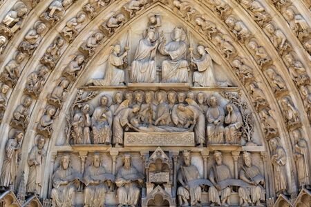 PARIS, FRANCE - JUNE 23, 2017: Fragment of the facade of the Notre-Dame de Paris. Is a medieval Catholic cathedral and is considered to be one of the finest examples of French Gothic architecture.のeditorial素材