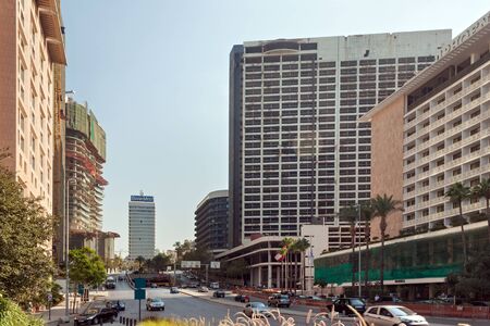 BEIRUT, LEBANON - AUGUST 14, 2014: Cityscape with residential buildings and abandoned (after civil war) high building in the central part of Beirut at summer.のeditorial素材