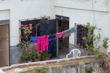 Drying washed clothes on the balcony of one of the houses of Tetouan Medina in Northern Morocco. 