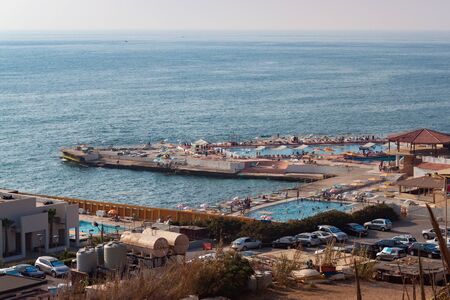 BEIRUT, LEBANON - AUGUST 14, 2014: View of the sea coast in the Raouche. Is a residential and commercial neighborhood in Beirut. It is known for its upscale apartment buildings and cliff-side cafes.のeditorial素材