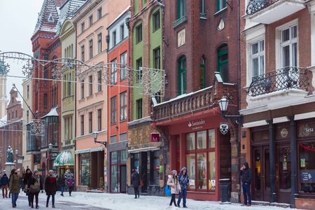 TORUN, POLAND - JANUARY 08, 2016: Old buildings on the Szeroka st. in historical part of the town. Torun is one of the oldest cities in Poland, with the first settlement dated back to the 8th century.のeditorial素材