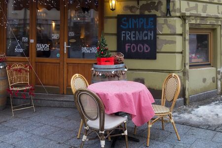 VILNIUS, LITHUANIA - DECEMBER 26, 2018: View of the street terrace of cafe with simple rrench food in historical part of city.のeditorial素材