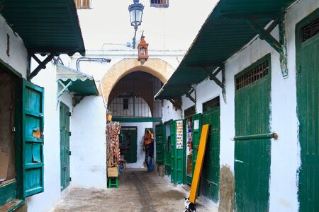 TETOUAN, MOROCCO - MAY 24, 2017: Green wooden doors of the old stores in Tetouan Medina quarter in Northern Morocco. A medina is typically walled, with many narrow and maze-like streets.のeditorial素材