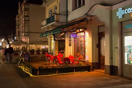 SOPOT, POLAND - DECEMBER 20, 2017: Night view of the street terrace of the Blekitny Pudel Pub on the Heroes of Monte Cassino Street in Sopot.のeditorial素材