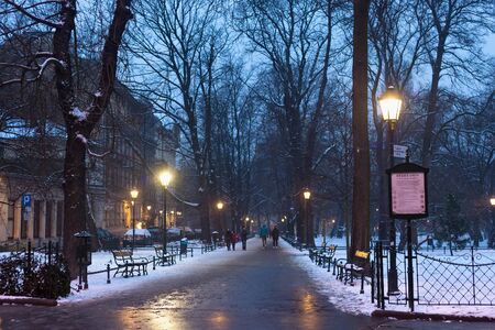KRAKOW, POLAND - JANUARY 06, 2016: Evening winter view of the famous city park Planty in historical part of Krakow.のeditorial素材