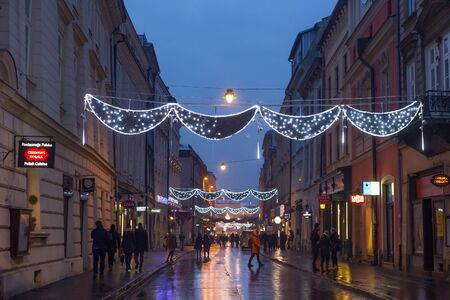 KRAKOW, POLAND - JANUARY 06, 2016: Evening view of the Slawkowska street in Christmas decoraion in historical part of Krakow.のeditorial素材