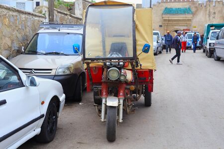 TETOUAN, MOROCCO - MAY 24, 2017: Old moto tricycle near the gate of Tetouan Medina in Northern...