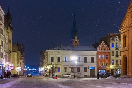 TORUN, POLAND - JANUARY 08, 2016: Night picturesque winter view of the old buildings in the historical part of the Torun on Rynek Nowomiejski square.のeditorial素材
